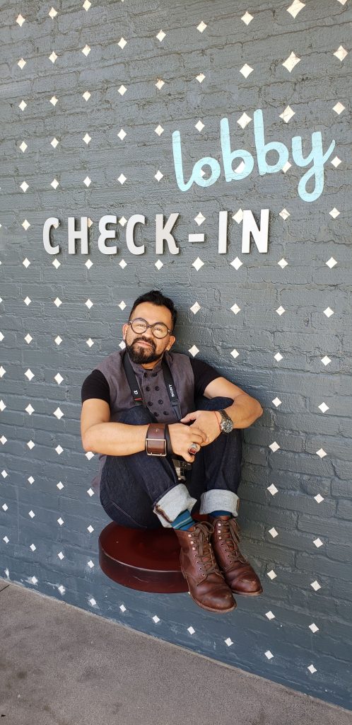 Owner and designer Danny Cordle Villegas sits in Palm Springs hotel lobby.